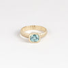 Blue Zircon Open Basket Signet on Ridged Band by Elizabeth Street Jewelry in size 6.5 is a one of a kind and oval cut blue zircon on a ridged band in 14k gold. Handmade in Los Angeles.