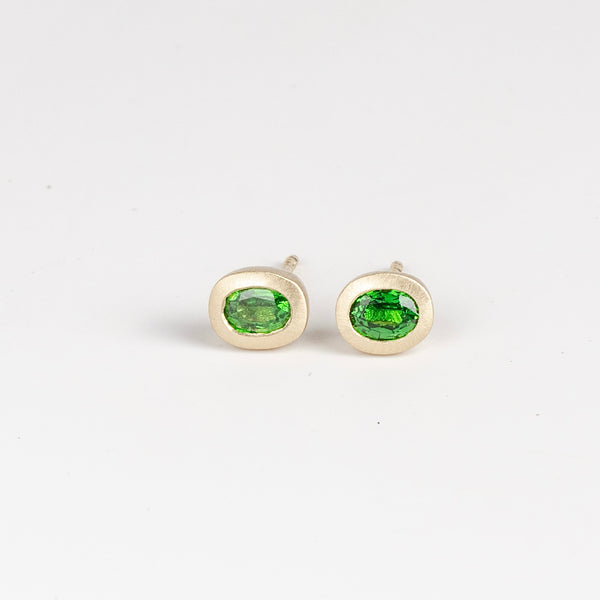 Tsavorite Oval Studs by Elizabeth Street Jewelry are a pair of heavy bezel and oval Tsavorite garnet .73tcw studs with post closure in 14k yellow gold. Handmade in Los Angeles