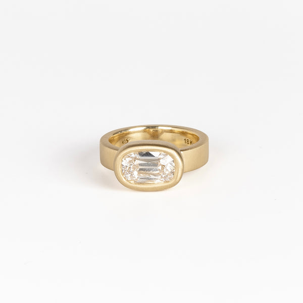 Jumbo Old Mine Solitaire Signet ring by Elizabeth Street is a bezel set cushion cut old mine lab grown white diamond solitaire on a wide and polished 18k gold band sized 6.5.