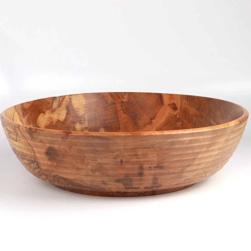Circle Factory Bowl in Maple with ridges is a turned wood bowl in natural Maple by George Peterson. Made from salvaged wood in North Carolina. It is Food safe, but finish can be affected if in contact with anything acidic. 