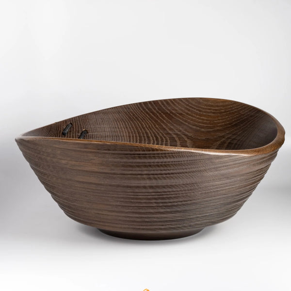 A big turned wood Circle Factory Bowl in Brown Oak With Ridges and Repair Detail by George Petersen on white background.