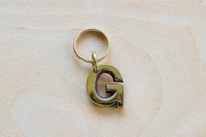 'G' Letter keyring, key chain, key ring in brass made by Carl Aubock. 