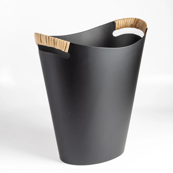 The Ørskov Wastebasket is made in matte black steel with cane wrapped handles and is 13" tall. It was designed by Grethe Kornerup-Bang in Denmark and is still  produced by Torben Orskow.