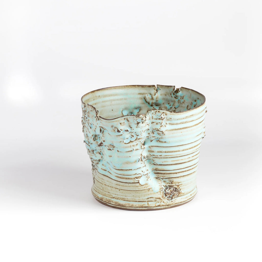 Hyejeong Kim Torn Vase #16 in blue celadon is a ceramic cylindrical torn vase by Hyejeong Kim on white background.