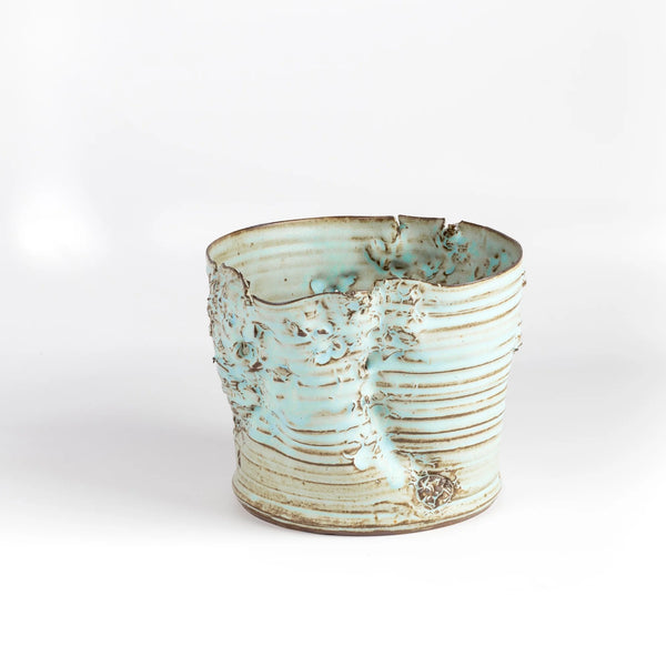 Hyejeong Kim Torn Vase #16 in blue celadon is a ceramic cylindrical torn vase by Hyejeong Kim on white background.