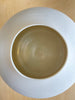Inside of Lilith Rockett Urn Vase is wheel thrown porcelain with gloss glaze on the interior and an unglazed exterior.