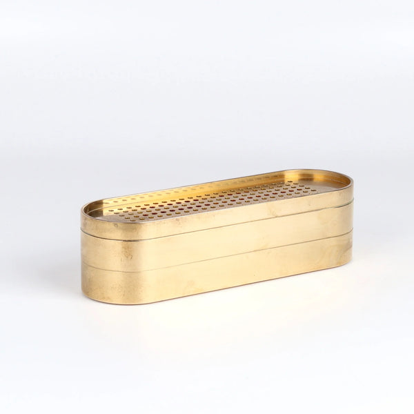 The 001 Stack Burner is a three tiered incense burner in polished brass designed by Populus project.