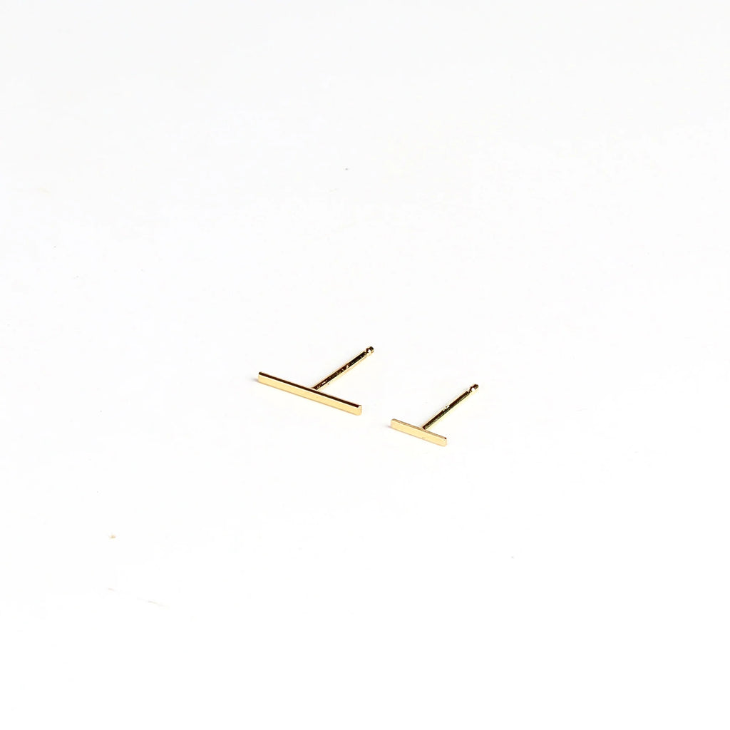 Kathleen Whitaker Staple Earring Bar stud in large and regular or small  in 14k yellow gold on white background.