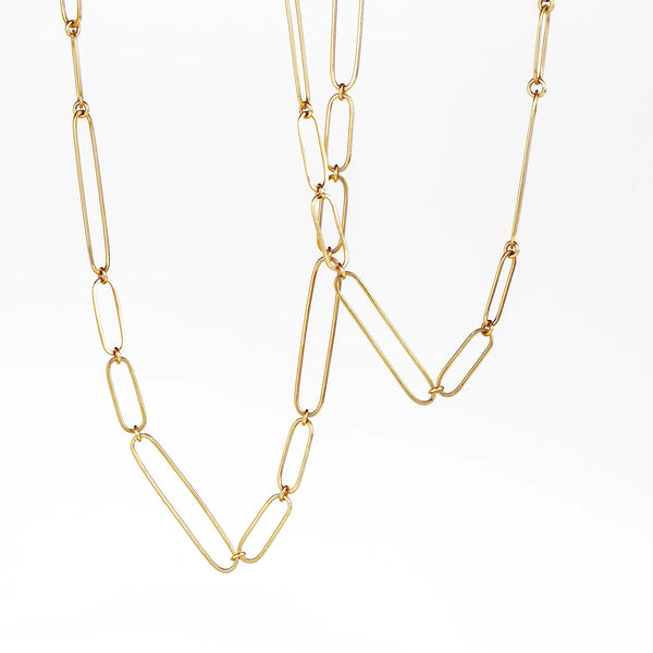 Long and short 14k gold paperclip chains (necklaces) with two short, one long flat clips in 15 or 17 inches by Kaylin Hertel on white background.