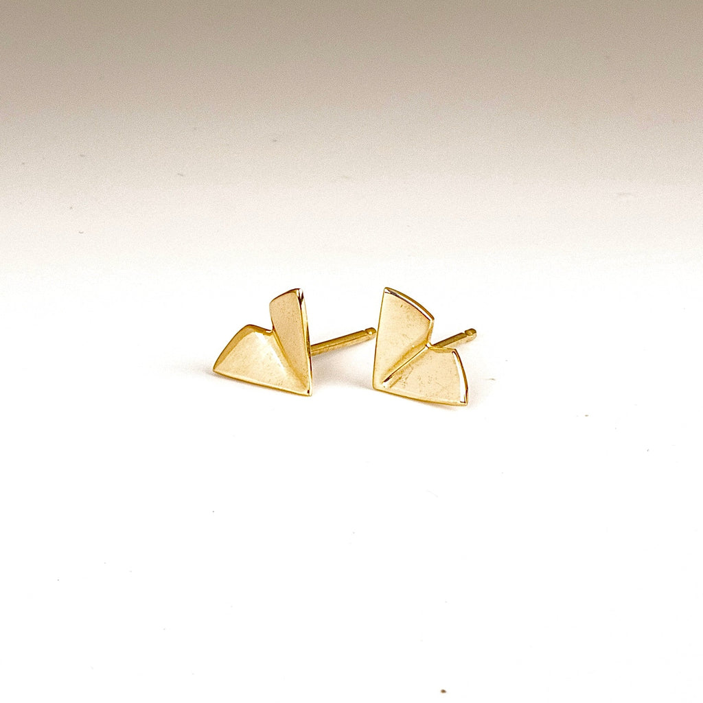 Large Kaylin Hertel Origami stud Studs Earrings in 14k yellow gold on white background.
