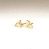 Large Kaylin Hertel Origami stud Studs Earrings in 14k yellow gold on white background.