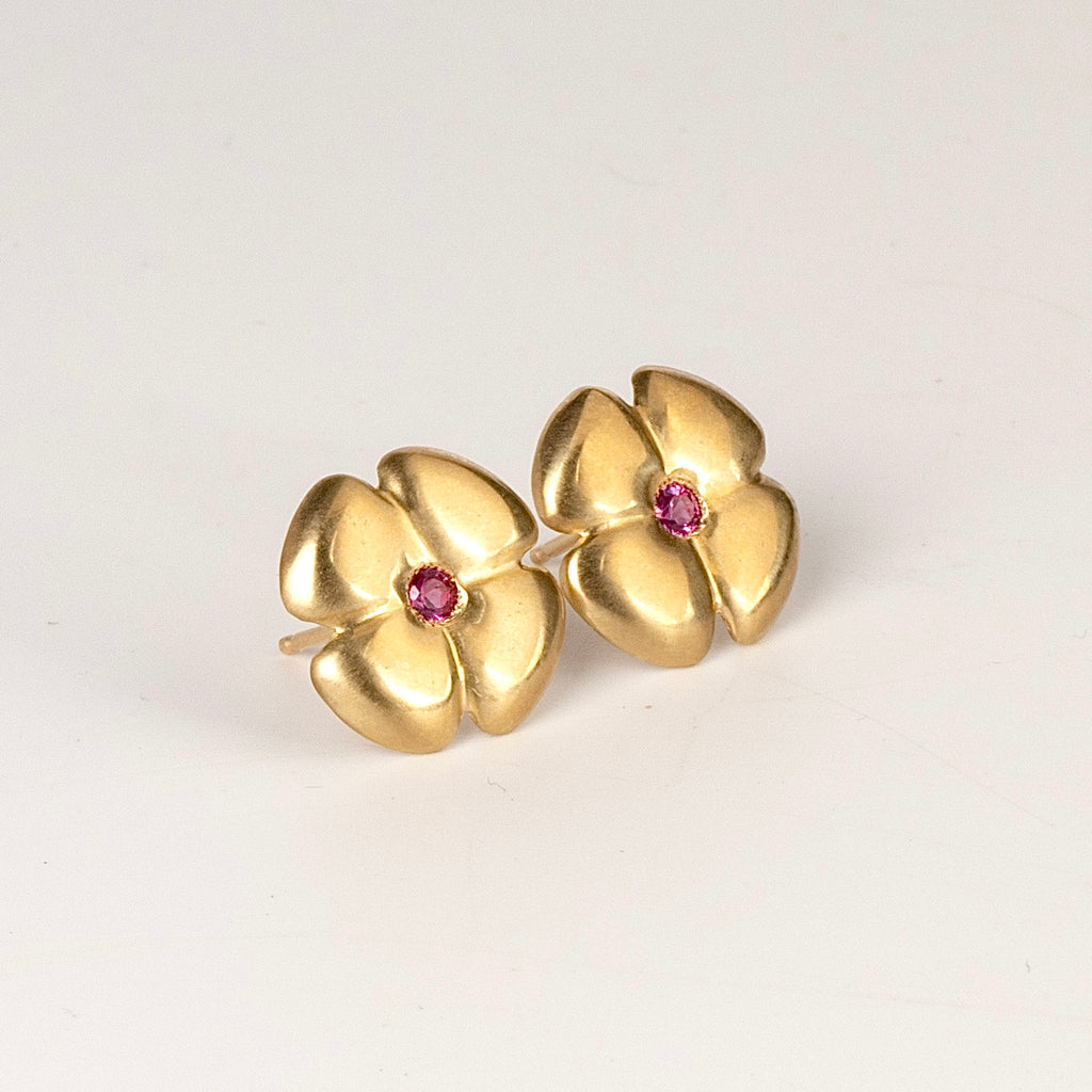 Large flower stud by Kaylin Hertel in magenta pink sapphire on white background.