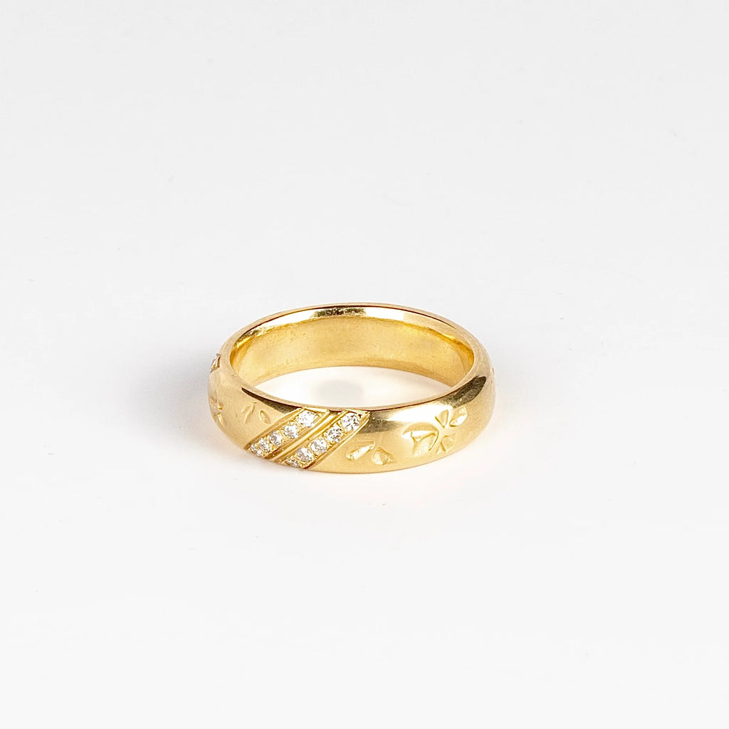 Striped Petal Print Band in 18k yellow gold with Canadian diamonds by Kaylin Hertel on white background.