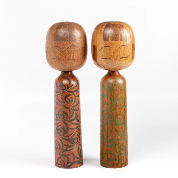 Two Lovely vintage artisan Kokeshi dolls by well known woodworker Kuribayashi Issetsu, founding father of Sosaku-Creative Movement.  Handmade in Japan. Painted and part of his "Mugen" series..
