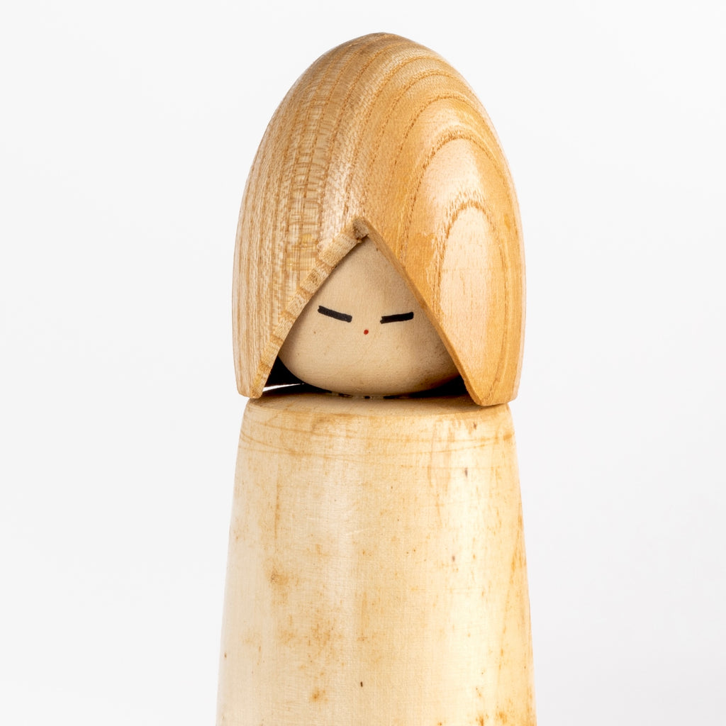 Close up on larger kokeshi by  Shido Shozan (1932-1995), 