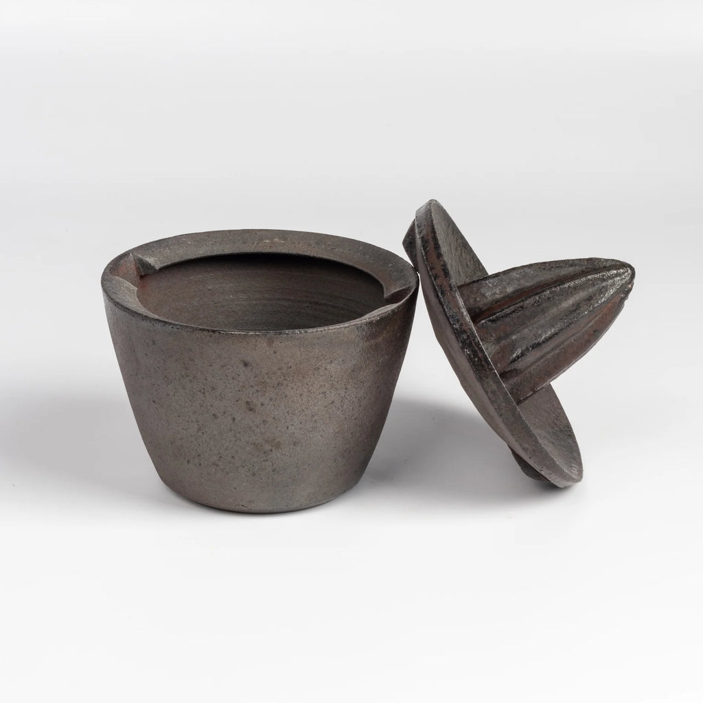 Lindsay Oesterritter Wood Fired Ceramic Juicer with lid on the side.