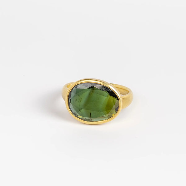 Green Tourmaline Greek ring by Pippa Small on white background.