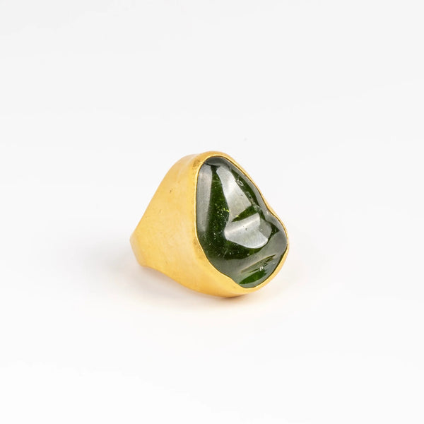 Green Tourmaline Tibetan ring by Pippa Small Jewellery on white background.