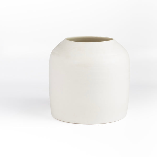 Lilith Rockett Urn Vase is wheel thrown porcelain with gloss glaze on the interior and an unglazed exterior.