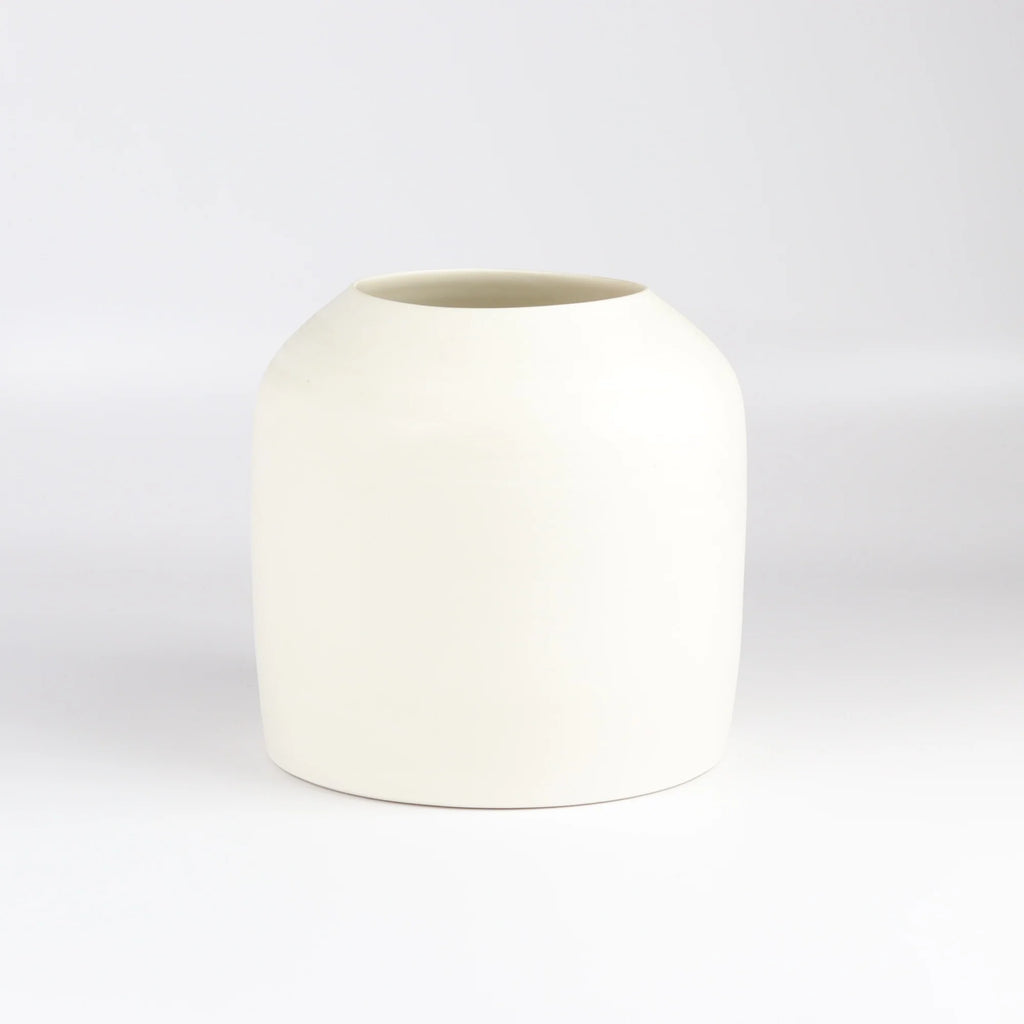 Lilith Rockett Urn Vase is wheel thrown porcelain with gloss glaze on the interior and an unglazed exterior.
