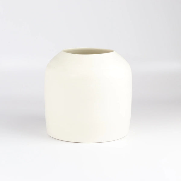 Lilith Rockett Urn Vase is wheel thrown porcelain with gloss glaze on the interior and an unglazed exterior.