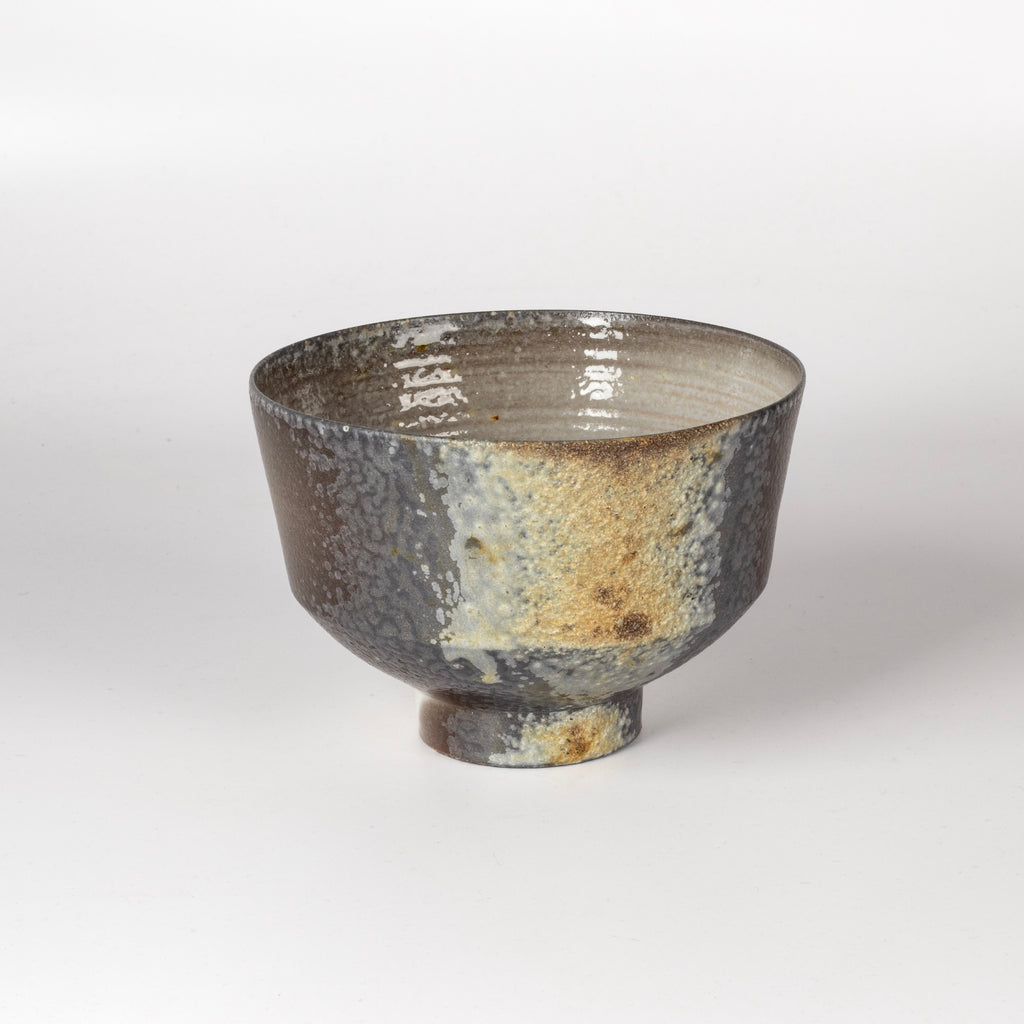 Kazegama Wood Fired Footed Tea Bowl is an exquisite one of a kind wood fired and reduction cooled tea bowl in grays and browns with a textured stripe. Hand thrown porcelain by Lilith Rockett, who works out of Portland, Oregon.