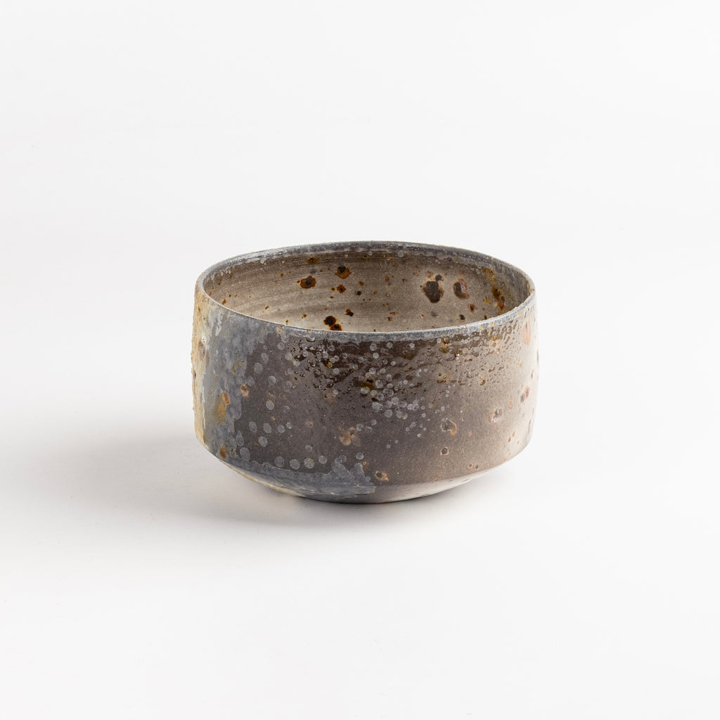 Other side of Wood Fired Tea Bowl With Spots by Lilith Rockett.