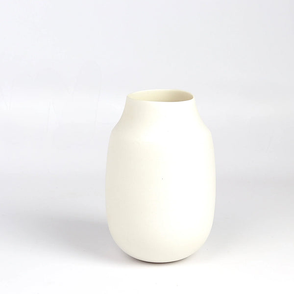 Lilith Rockett Vase with Neck "A" is Reminiscent of an eggshell, this vase is wheel thrown porcelain with gloss glaze on the interior and an unglazed exterior. It has been sanded smooth and it is very stable despite its rounded bottom. 