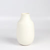 Lilith Rockett Vase with Neck "B" is Reminiscent of an eggshell, this vase is wheel thrown porcelain with gloss glaze on the interior and an unglazed exterior. It has been sanded smooth and it is very stable despite its rounded bottom. 