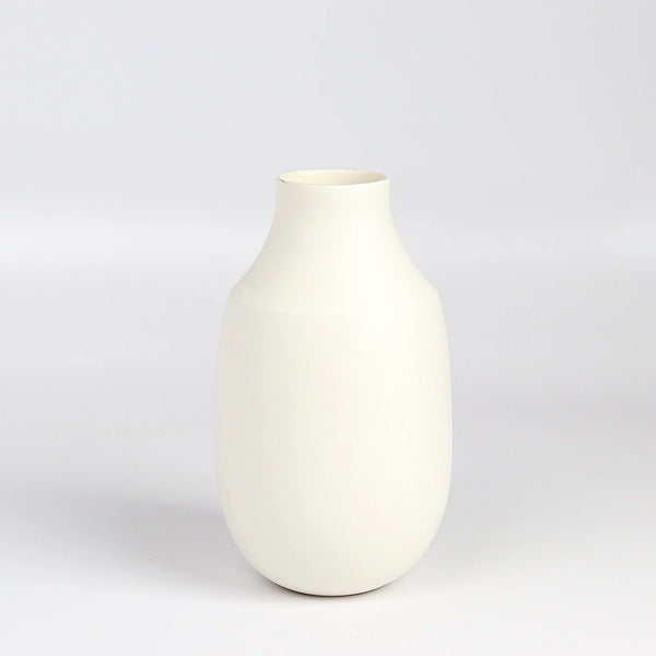 Lilith Rockett Vase with Neck "B" is Reminiscent of an eggshell, this vase is wheel thrown porcelain with gloss glaze on the interior and an unglazed exterior. It has been sanded smooth and it is very stable despite its rounded bottom. 