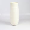 Lilith Rockett Tall vase is reminiscent of an eggshell. It is hand thrown porcelain with gloss glaze on the interior and an unglazed exterior that has been sanded smooth and it is very stable despite its rounded bottom. Handmade in Portland, Oregon. 