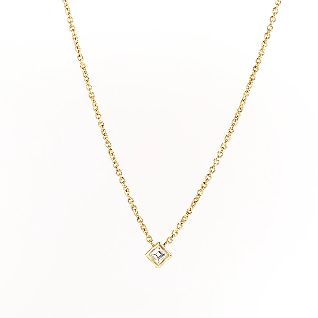 Carre Cut Diamond Bezel Solitaire Necklace by Lizzie Mandler is a A beautiful carre cut and bezel set diamond pendant on a classic adjustable cable chain in 18k yellow gold. 
