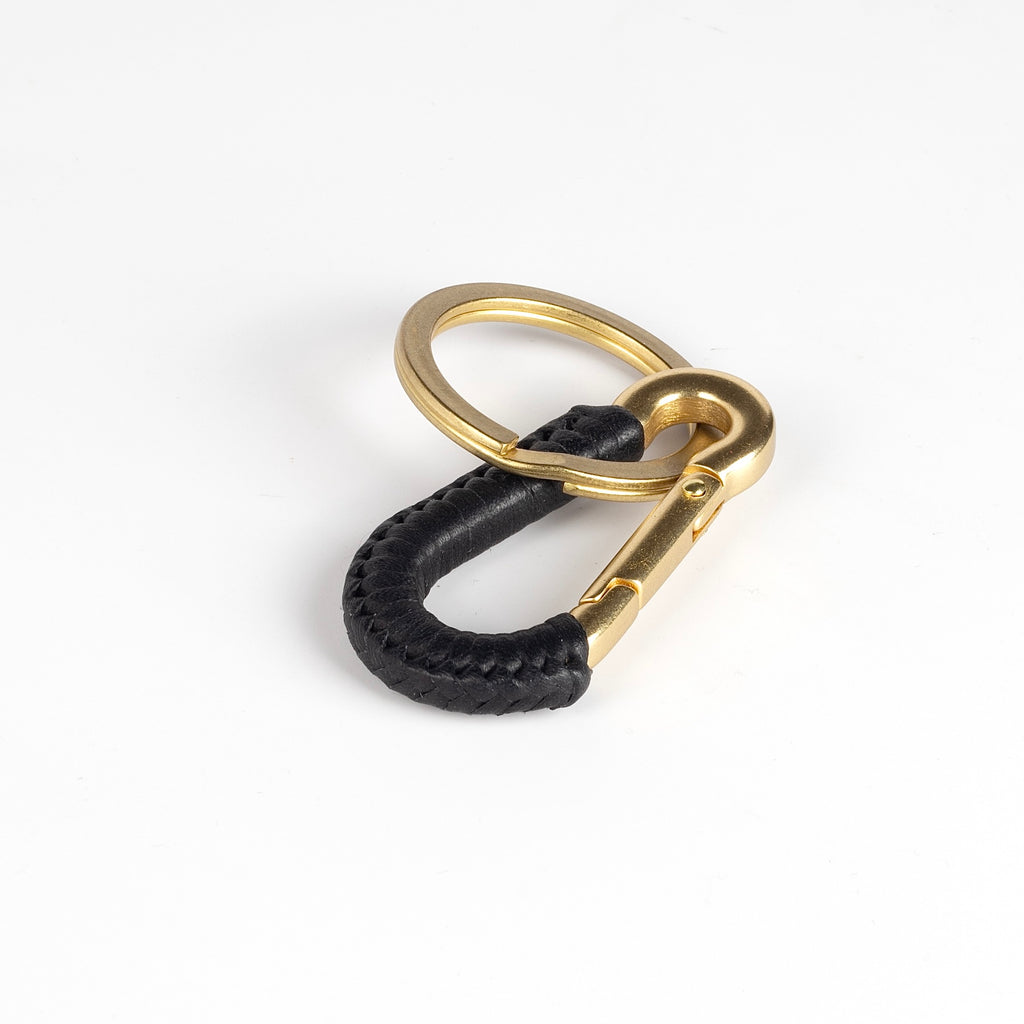 Black leather carabiner clip or key fob in brass, braided in leather by Matthew Ready. Handmade in Los Angeles.