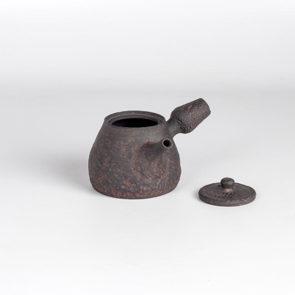 Dark brown Kyusu teapot D by Muzuri ware with lid on the side.