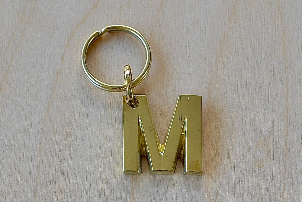 'M' Letter keyring, key chain, key ring in brass made by Carl Aubock. 