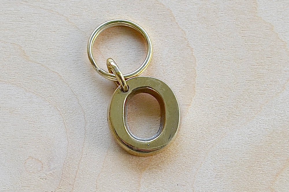 'O' Letter keyring, key chain, key ring in brass made by Carl Aubock. 