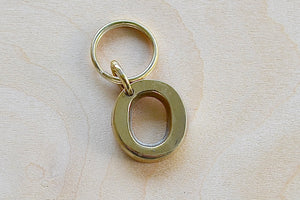 'O' Letter keyring, key chain, key ring in brass made by Carl Aubock. 