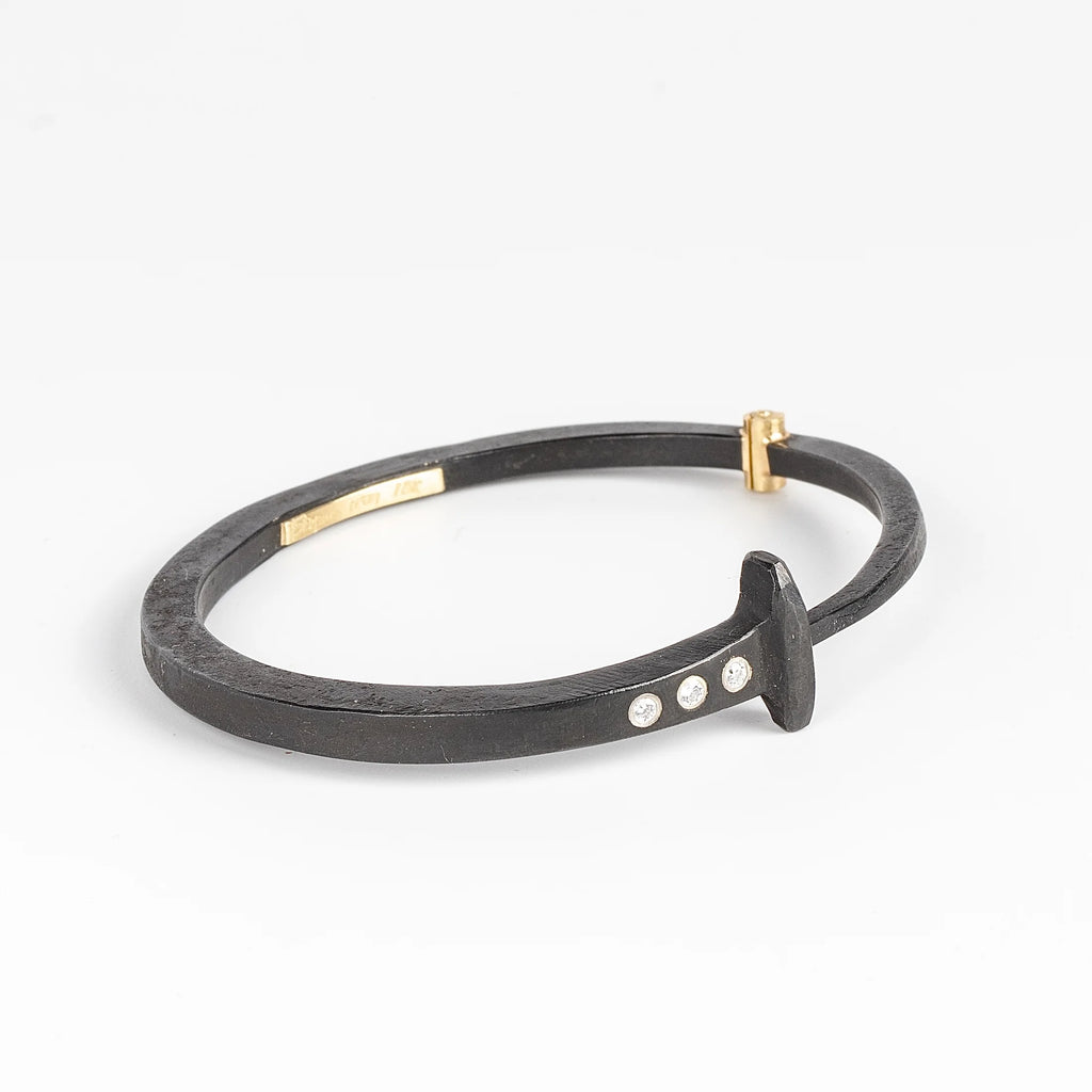 Pat Flynn Three stone Nail Bracelet Forged Blackened iron Diamonds, 18k gold hinge on white background.