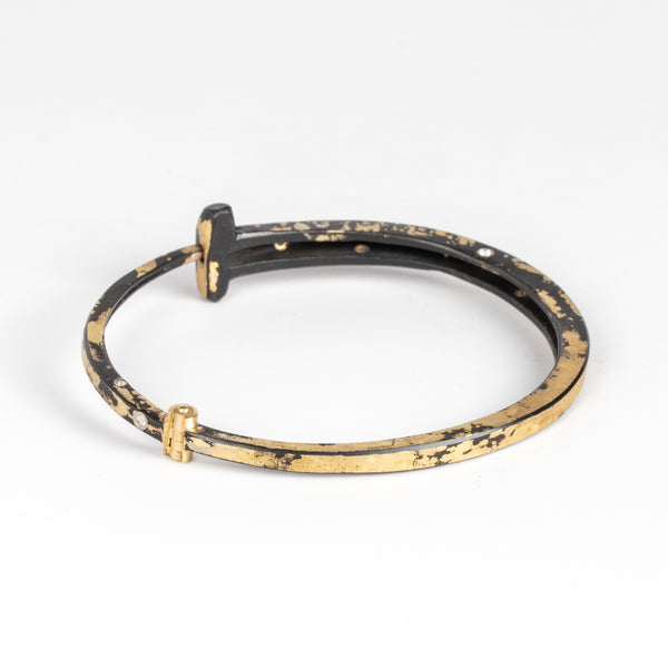 Back of Nine Stone Dust 9 Nail Bracelet by Pat Flynn.