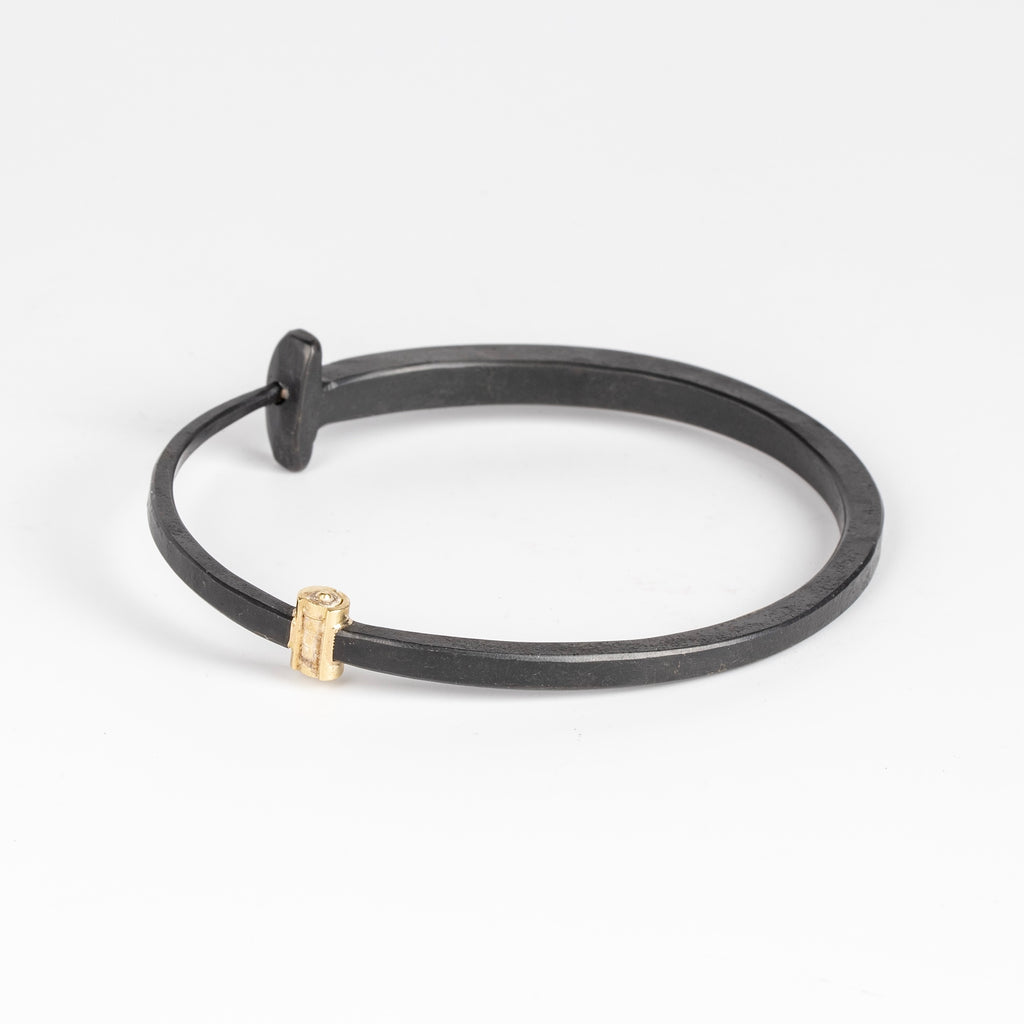 Back of large forged nail bracelet by Pat Flynn.