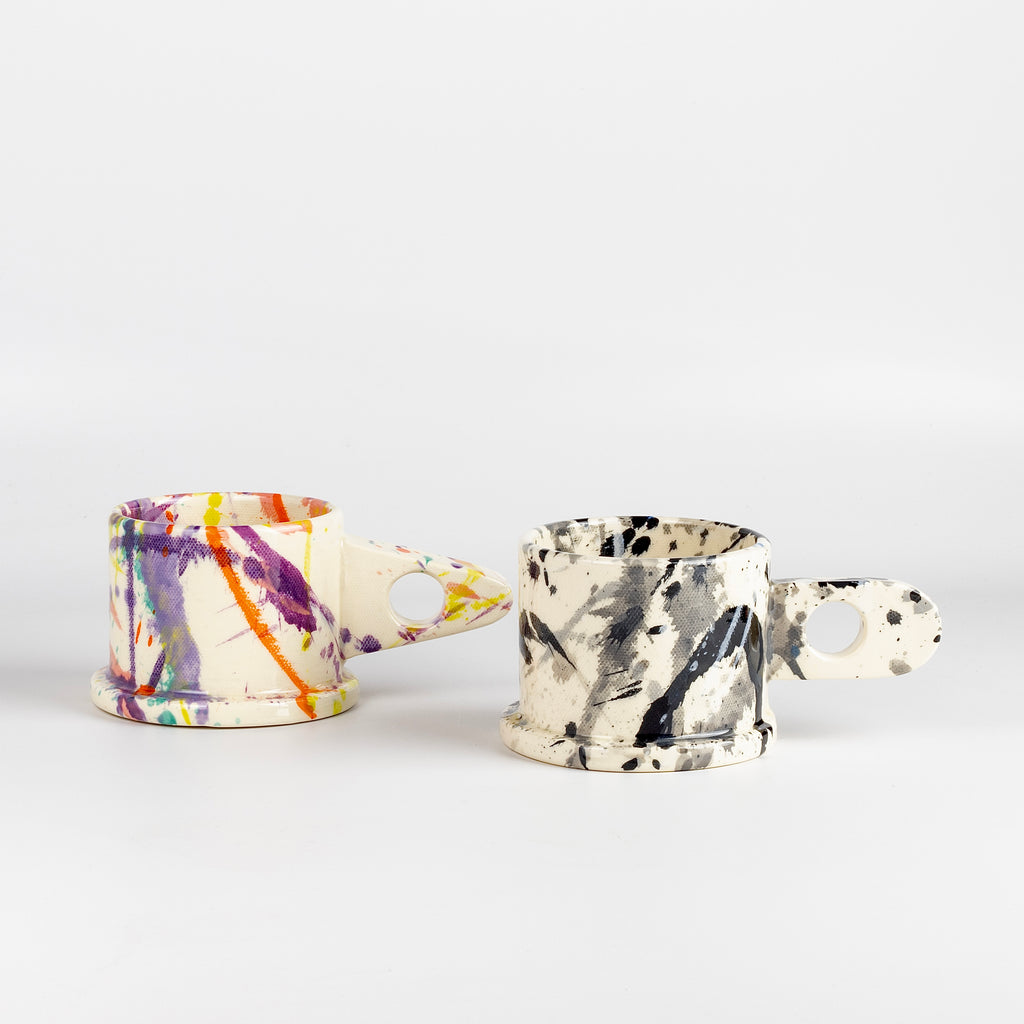 A selection of EXP standard splatter mugs by Peter Shire and Echo Park Pottery.