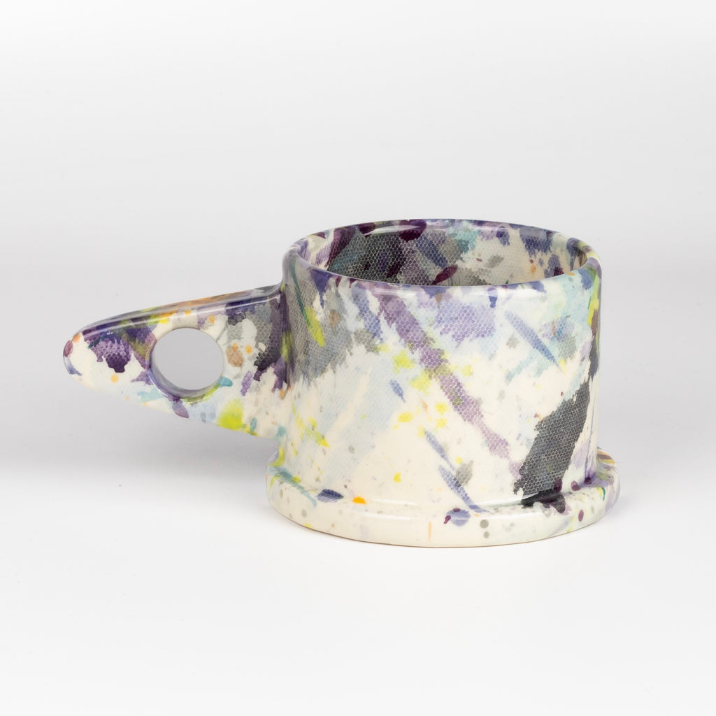 Other side of EXP Standard Splatter Mug in Purple, Lime Green and Orange.