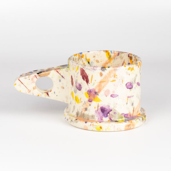 Other side of EXP Standard Splatter Mug in Purple, Orange, Blue with Peach.