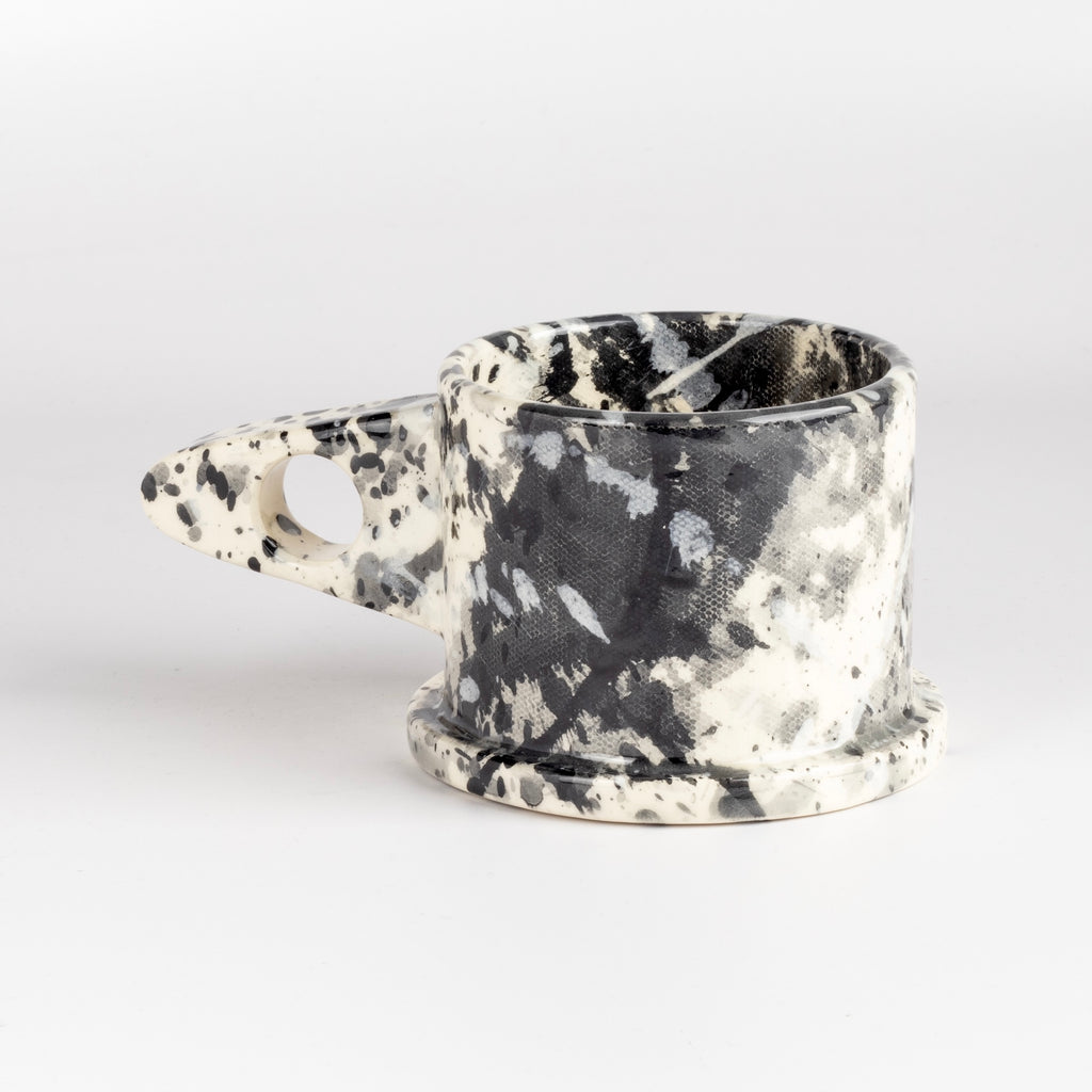 Other side of black, white and gray EXP ceramic splatter mug by Peter Shire and Echo Park Pottery.