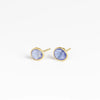 Angled view of the new and smaller version of Pippa Small Classic Stud studs earrings in Tanzanite and 18k yellow gold
