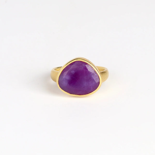 Sugalite Greek ring by Pippa Small Jewelry is a n Organically shaped, hand cut, and faceted sugalite stone set in 18k yellow gold. Size 6.5 in stock.