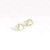Angled view of Pippa Small Classic Stud studs earrings in aquamarine and 18k yellow gold on white background.