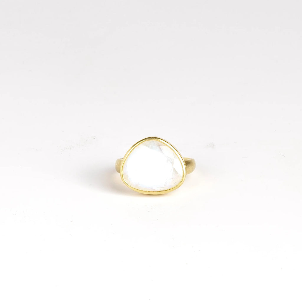 Rainbow Moonstone Greek Ring is designed by Pippa Small Jewellery. This large Greek ring is an Organically shaped and hand cut, faceted and translucent rainbow moonstone set in 18k yellow gold. Size 6.5 in stock