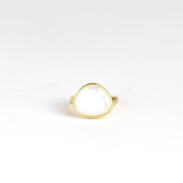 Rainbow Moonstone Greek Ring is designed by Pippa Small Jewellery. This large Greek ring is an Organically shaped and hand cut, faceted and translucent rainbow moonstone set in 18k yellow gold. Size 6.5 in stock