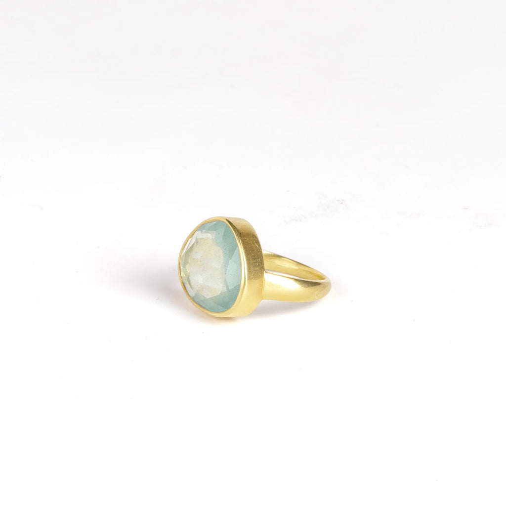 Side view of Large Greek ring in aquamarine by Pippa Small on white background.